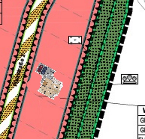 Lageplan eines Grundstücks mit Hausgrundriss und Bäumen am Rand