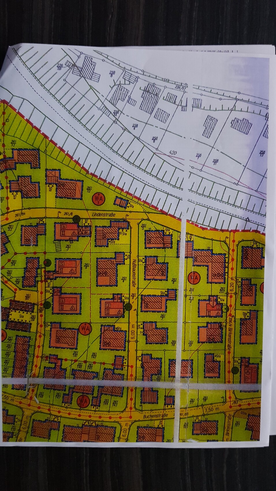 Lageplan eines Wohngebiets mit Grundstücken, Straßen und Gebäuden