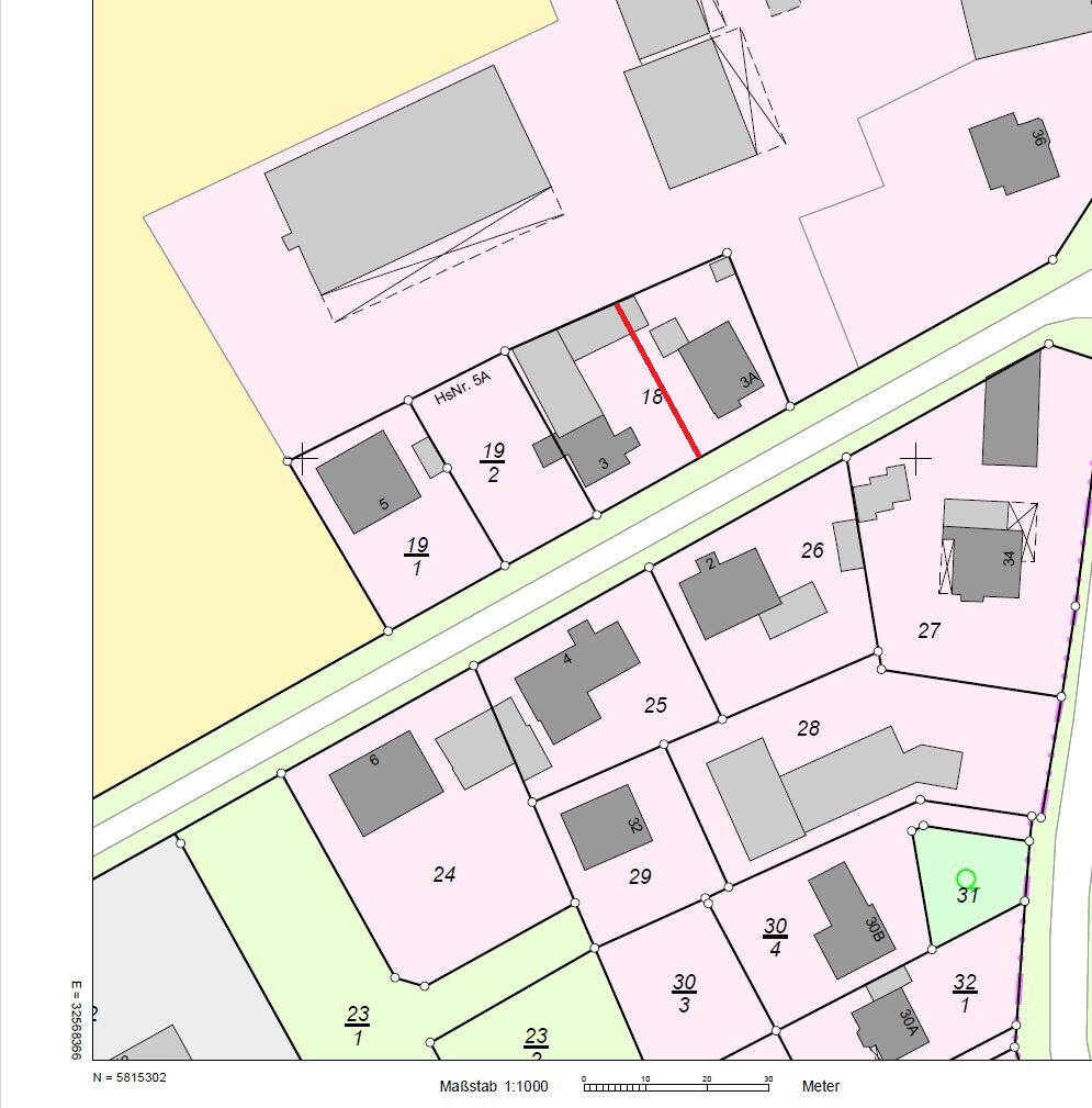 Lageplan eines Siedlungsgebietes mit nummerierten Parzellen, Straßenverlauf und Gebäuden