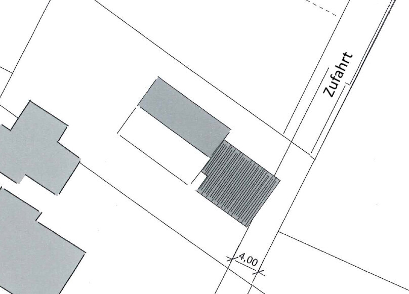 Lageplan eines Grundstücks mit Zufahrt, Gebäudeflächen und Gebäudestrukturen