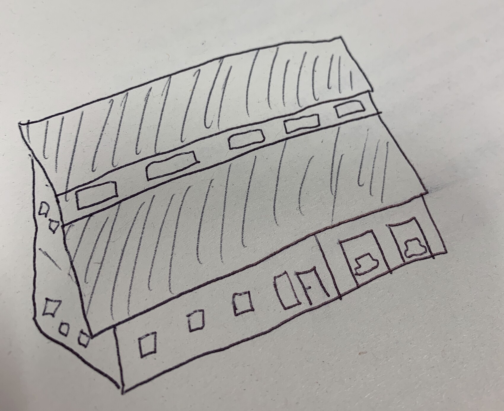 Längliches, zweistöckiges Gebäude in Skizze mit schrägem Dach, Fensterreihen und Türen.