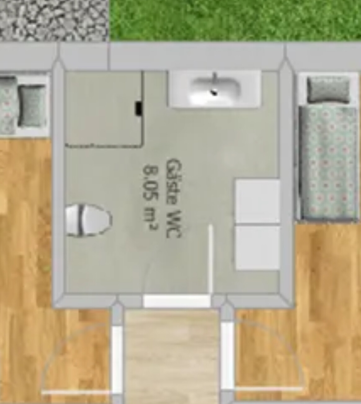 Grundriss eines kleinen Wohnraums mit Gäste-WC, Waschbecken, Toilette und Möbeln.