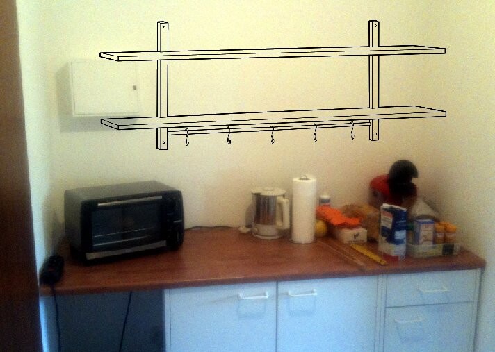 Küchenzeile mit Arbeitsplatte, Toaster-Backofen, Wasserkocher und Gewürzen
