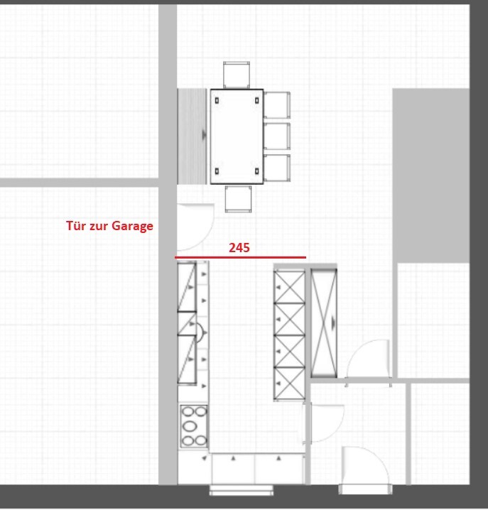 Grundriss eines Küchen- und Essbereichs mit Tür zur Garage, Esstisch und Schränken.