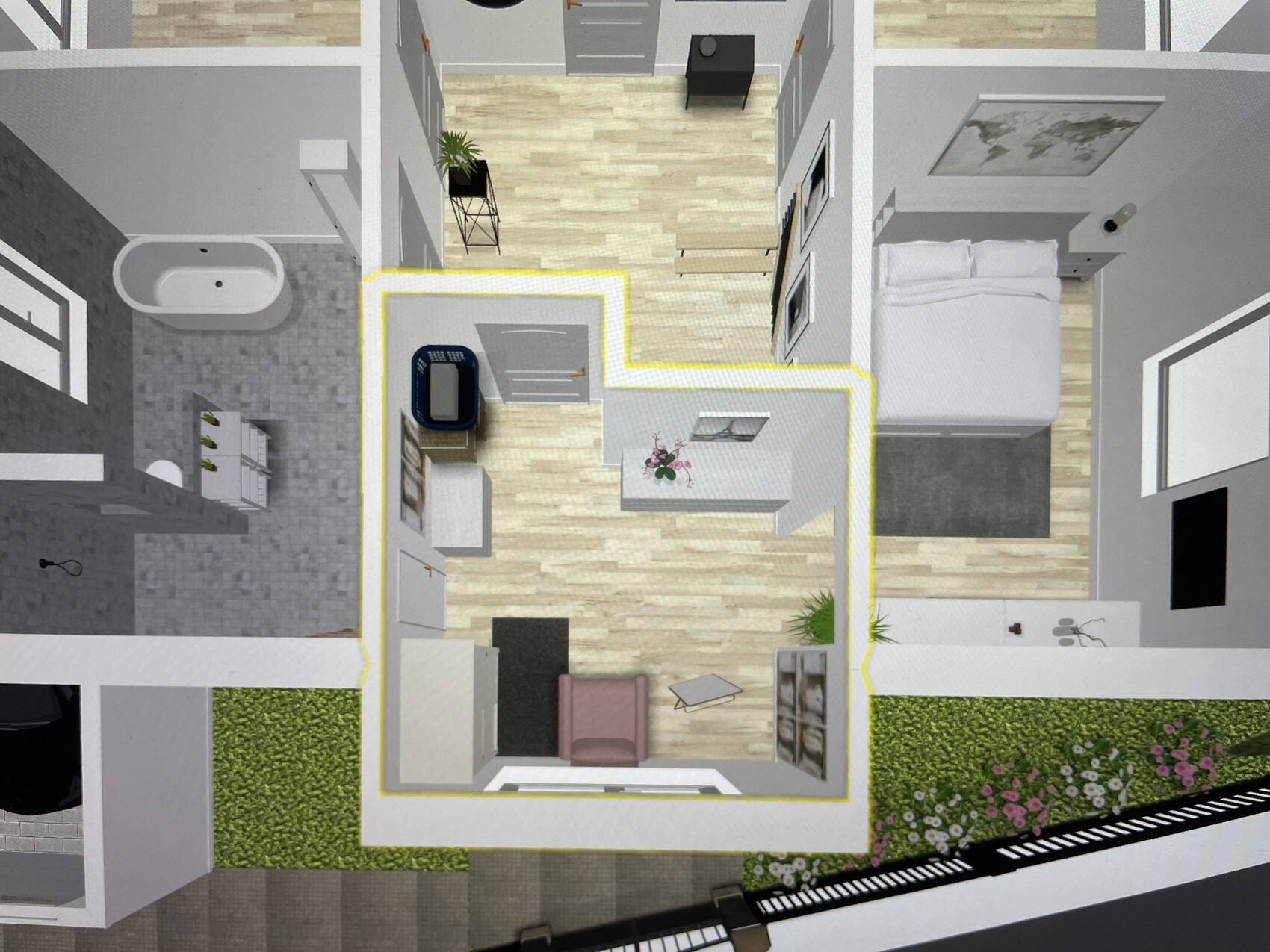 Grundriss einer Wohnung von oben mit gelber Umrandung, Schlafzimmer, Bad, Küche, Wohnzimmer.