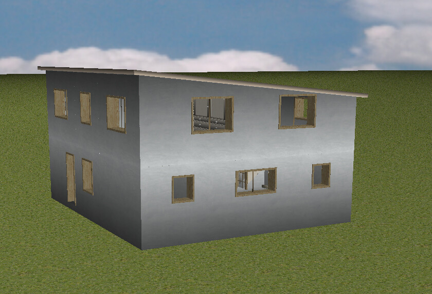 Zweistöckiges graues Haus mit leeren Fensterrahmen auf grünem Rasen, seitliche Perspektive.