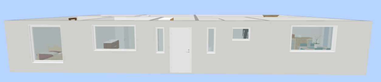 Flaches, hellgraues Wohnhaus mit mehreren Fenstern und zentraler Tür vor blauem Himmel