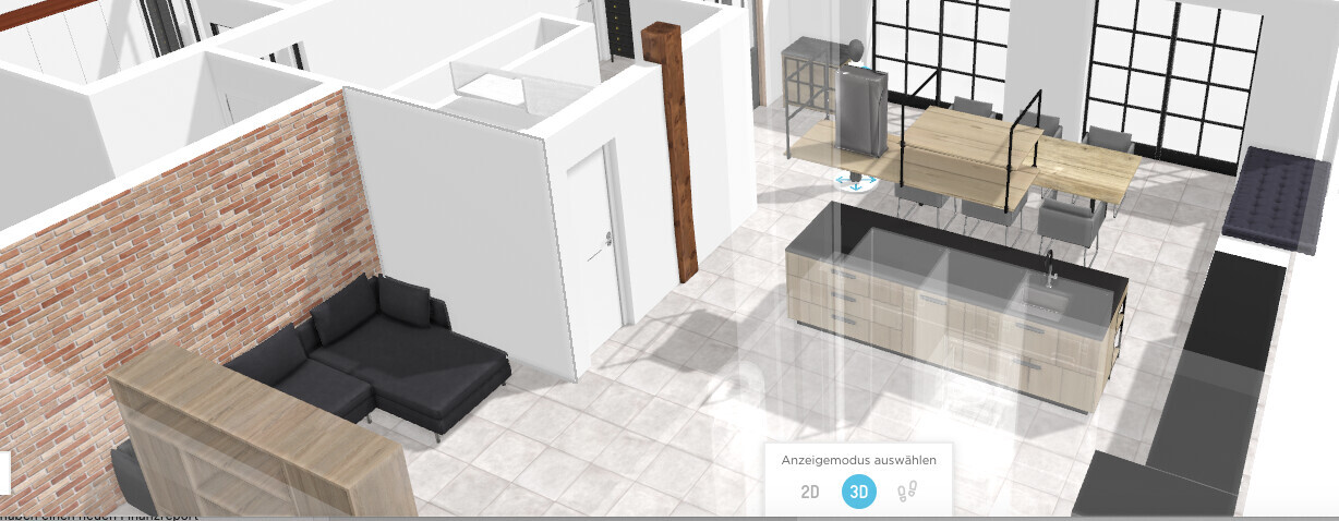 Offenes Loft-Design: Wohnzimmer mit grauem Sofa, Kücheninsel, Esstisch und Backsteinwand.