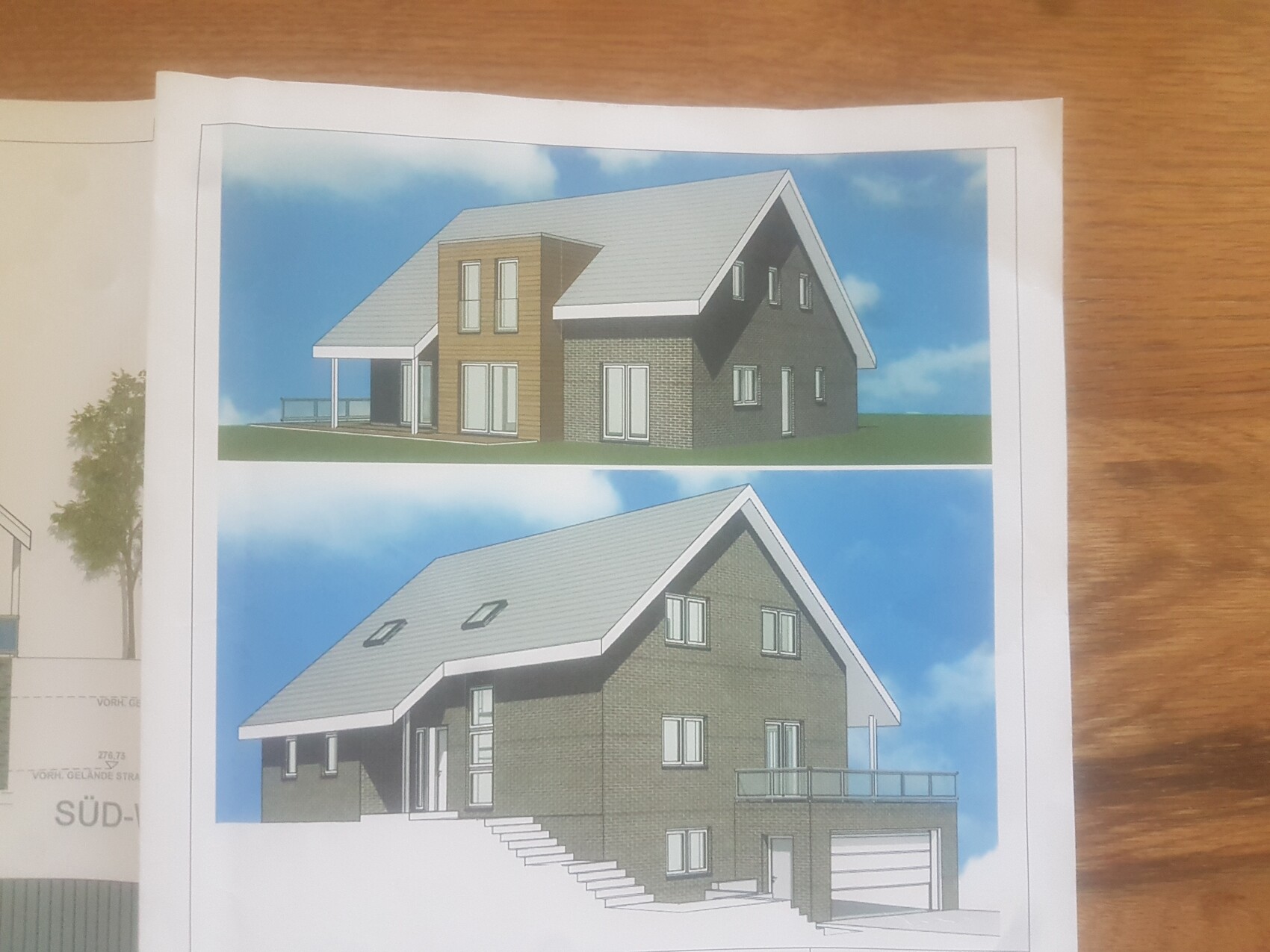 Zwei Renderings eines modernen Einfamilienhauses mit Satteldach, Holz- und Ziegelverkleidung, Terrasse.