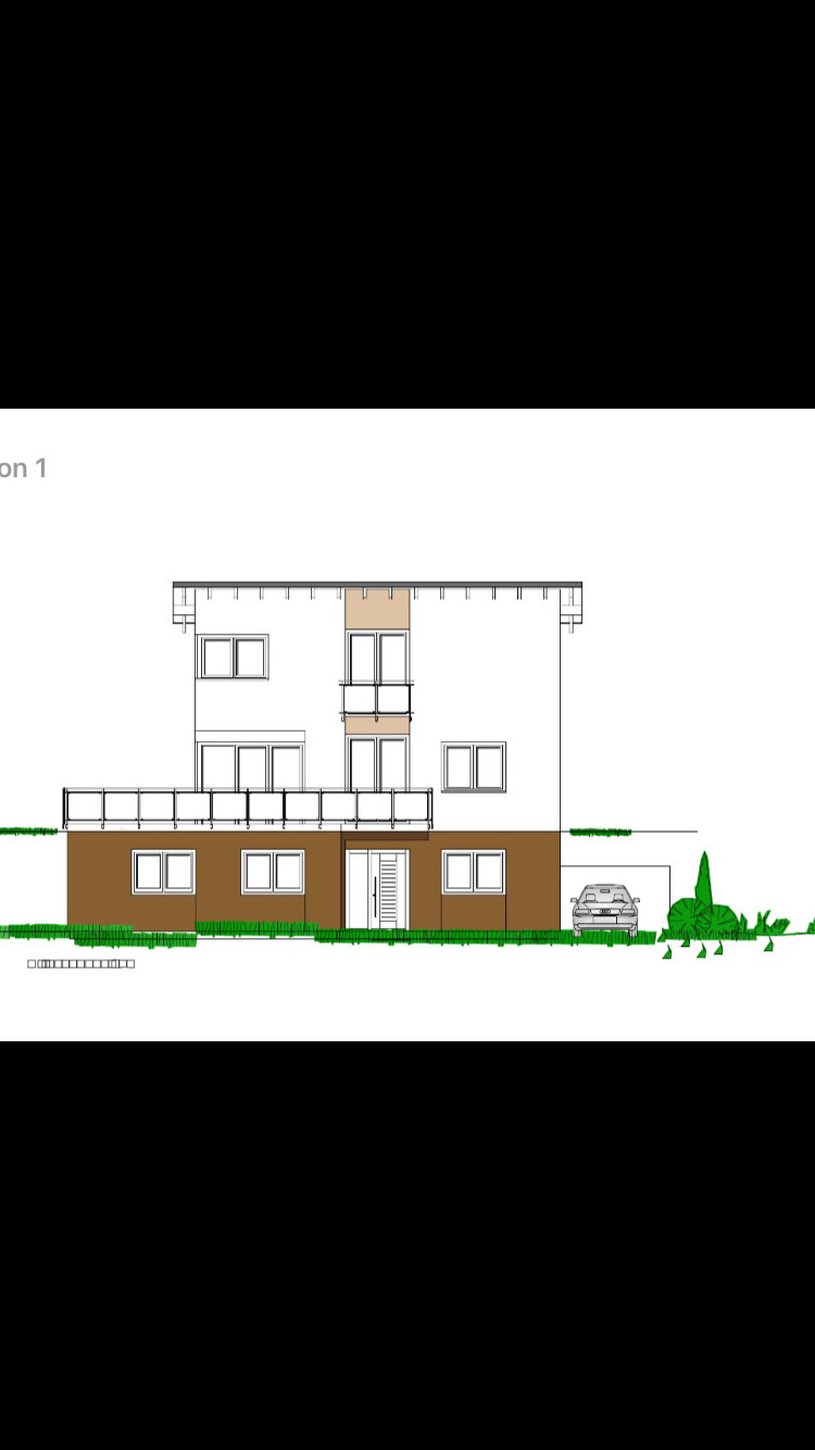 Frontansicht eines modernen zweigeschossigen Hauses mit Balkon, Terrasse und Auto