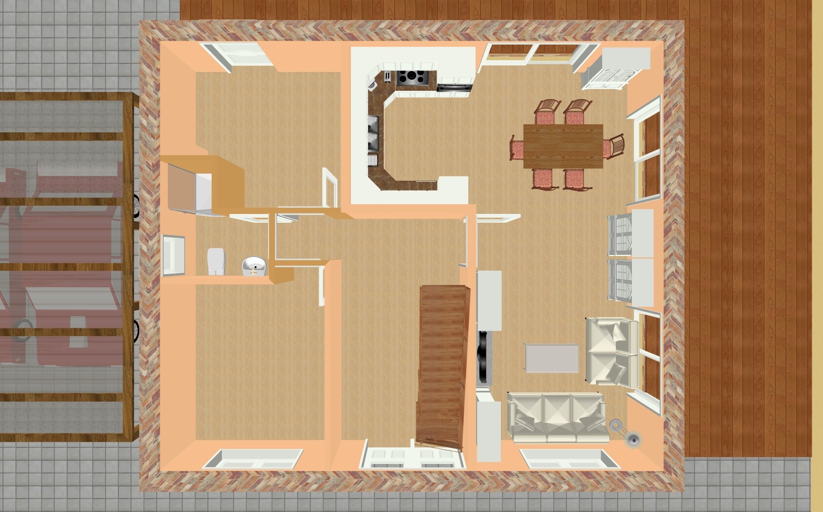 Grundriss-Ansicht von oben: Küche mit Insel, Esstisch, Wohnzimmer mit Sofa und TV.