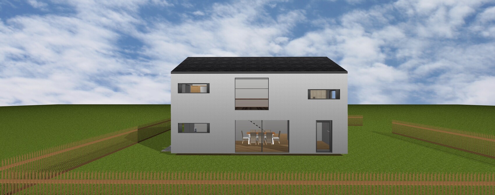 Modernes, zweigeschossiges graues Haus mit großen Glasfenstern auf offener Wiese und Zaun.