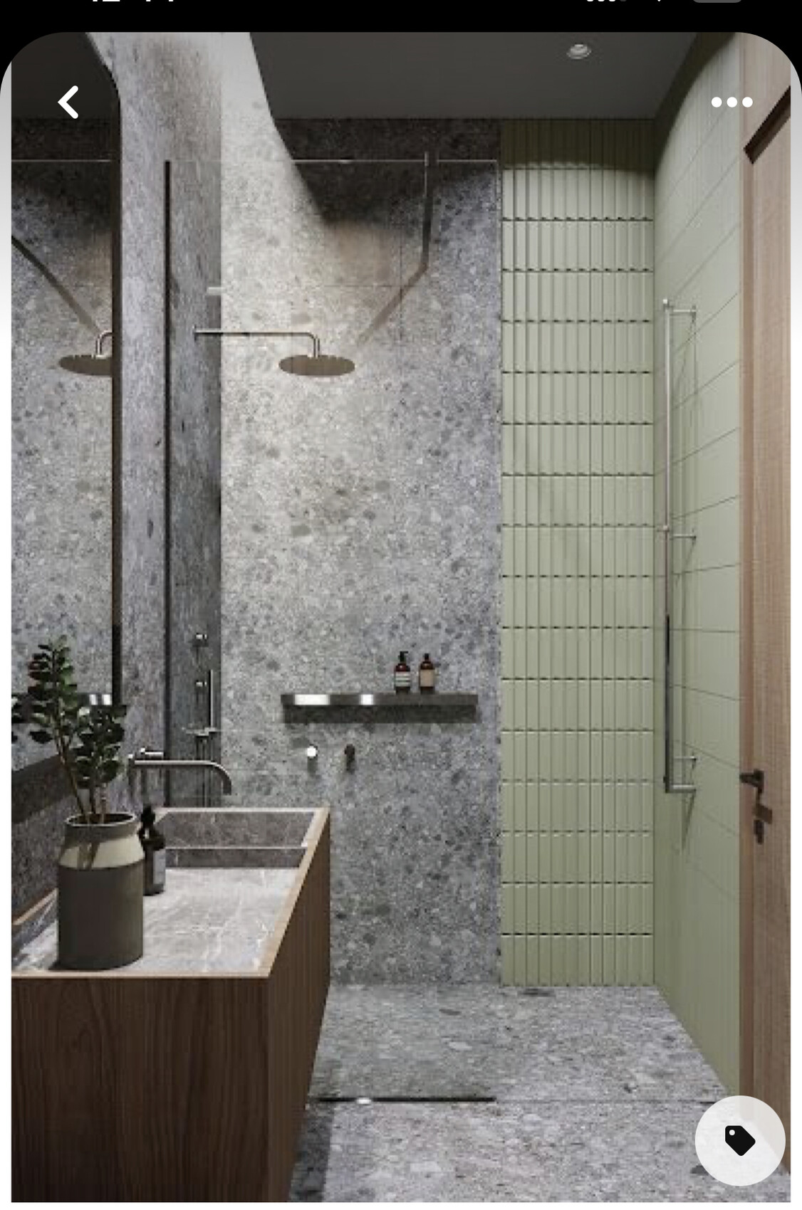 Modernes Badezimmer mit grauer Steinwand, Holz-Waschtisch, Pflanze und grüne geflieste Wand.