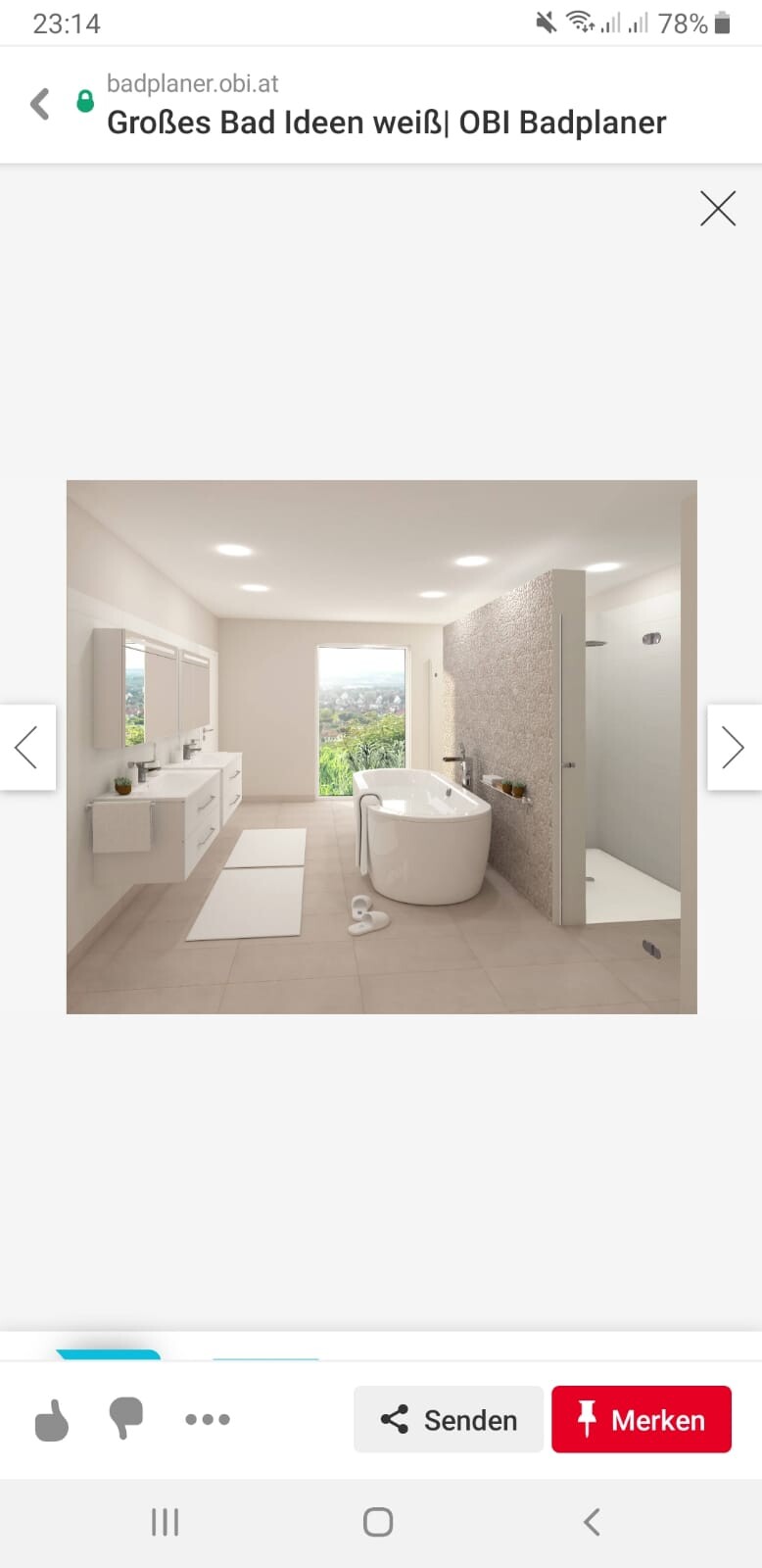 Helles Badezimmer mit freistehender Badewanne, Doppelwaschbecken, Dusche und Fensterblick ins Grüne.