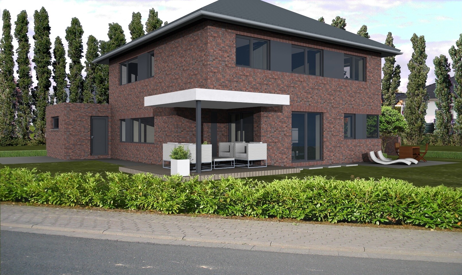 Zweistöckiges Backsteinhaus mit überdachter Terrasse und Sitzgruppe im Garten.