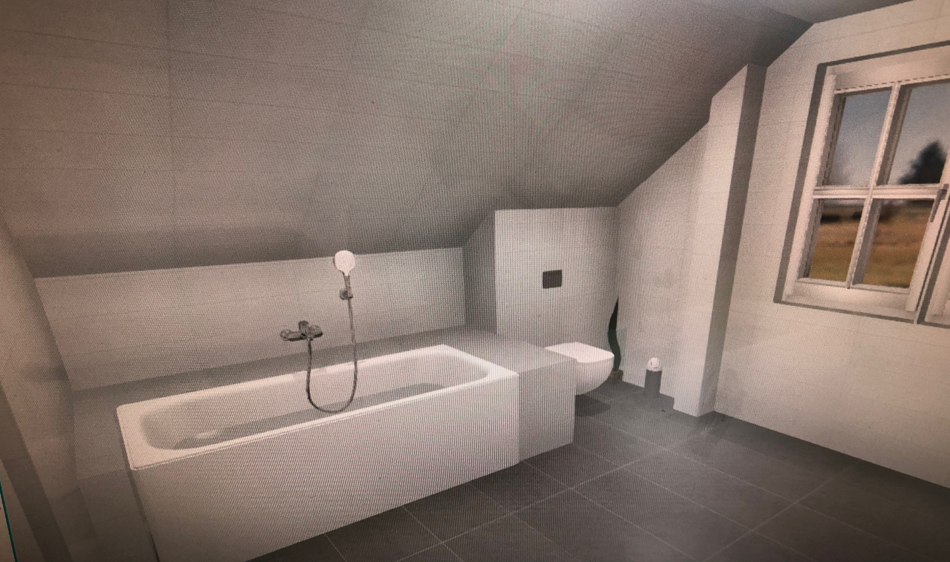 modernes-bad-mit-badewanne-und-fenster-im-dachgeschoss.JPG