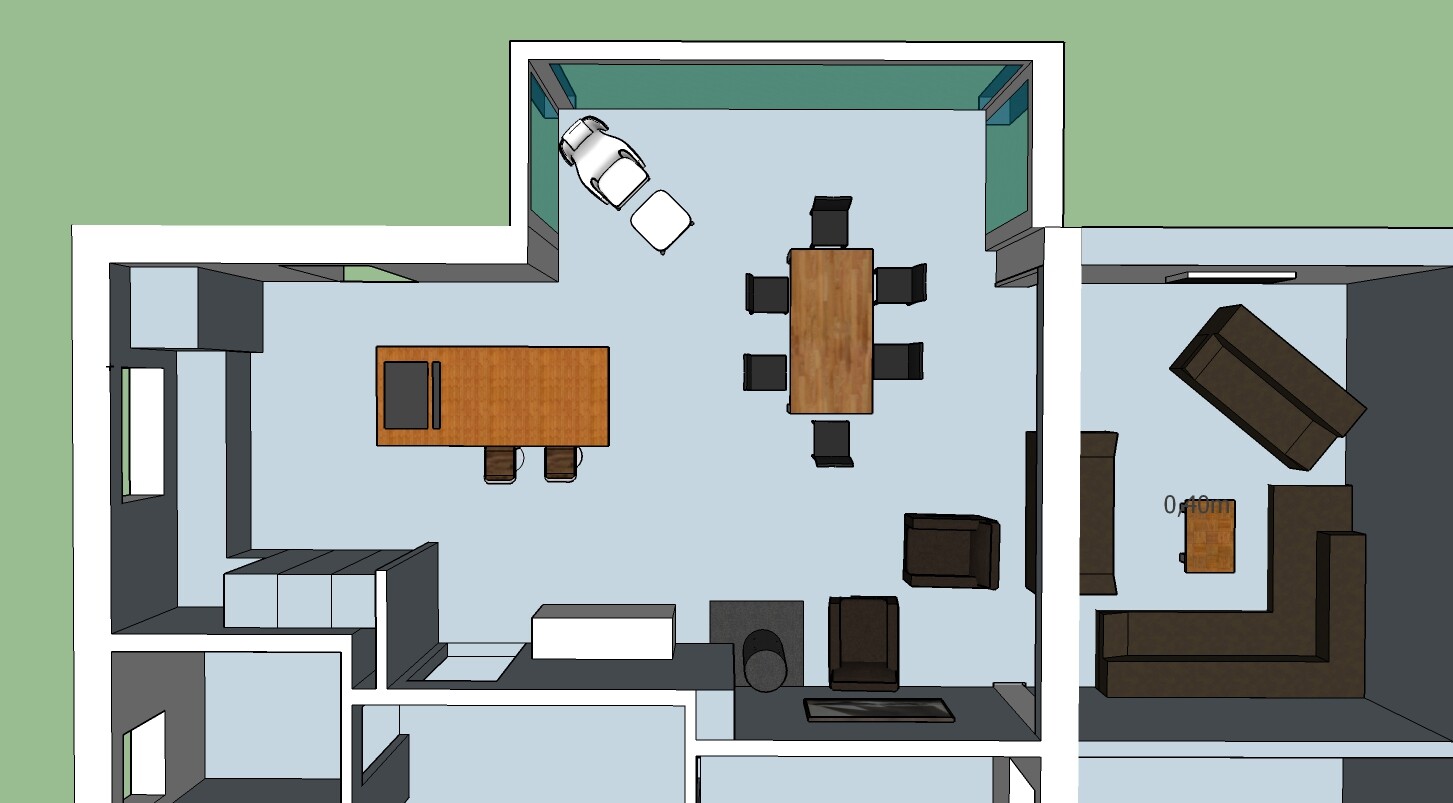 Grundriss eines offenen Wohn- und Arbeitsbereichs mit Esstisch und Sofas