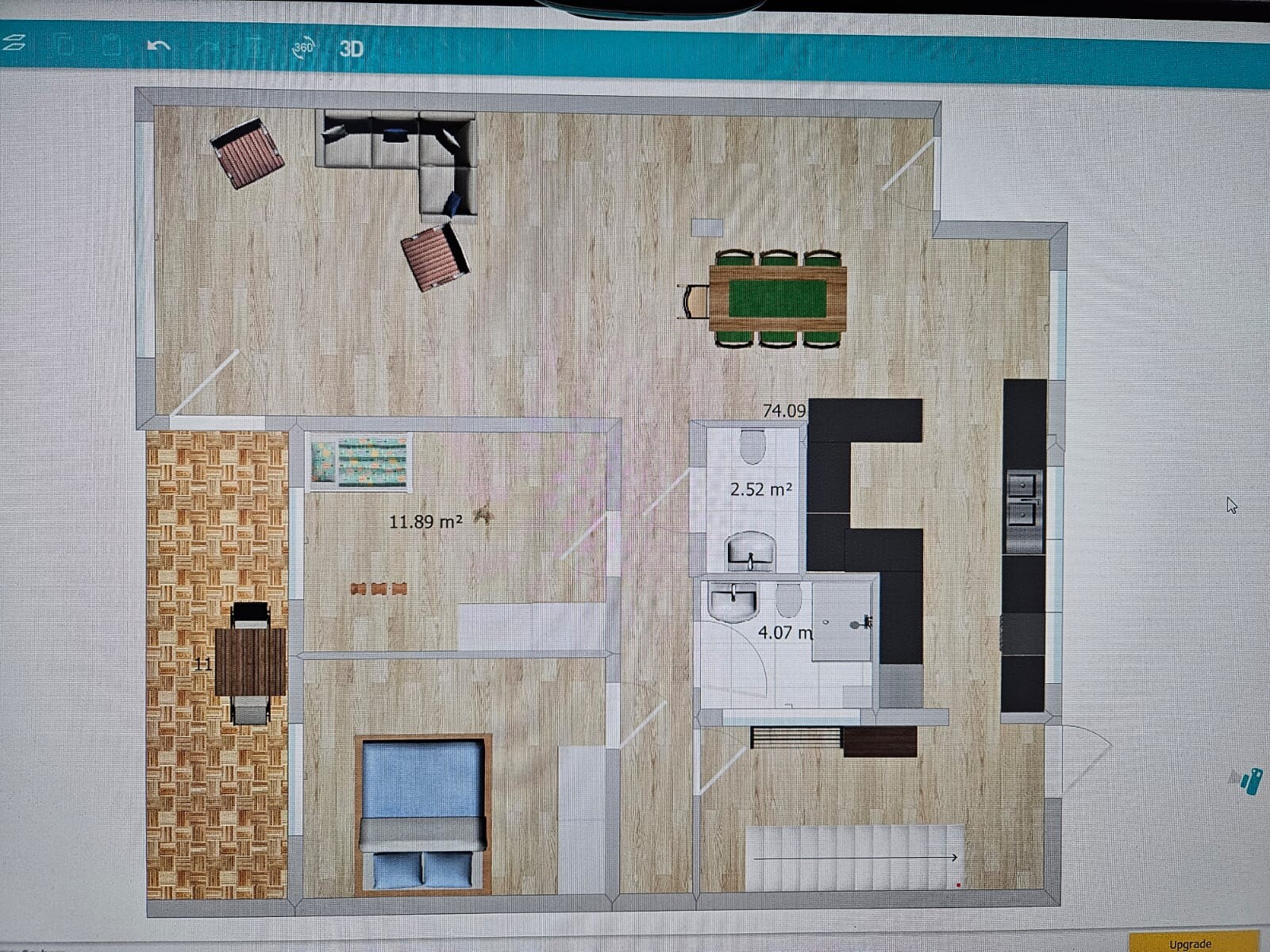 Grundriss einer Wohnung: Wohnzimmer mit Sofa, Esstisch, Küchenzeile, Badezimmer und Schlafzimmer.