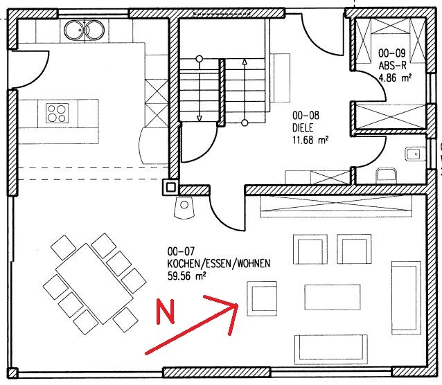 Grundriss einer Wohnung mit offener Küche, Ess- und Wohnbereich, Diele; Nordpfeil markiert.