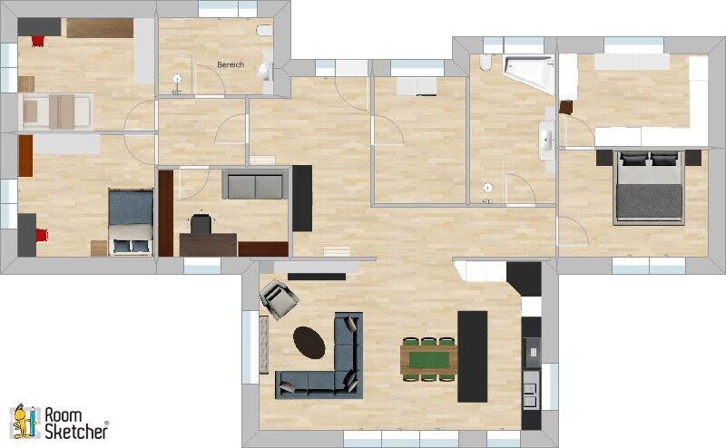 Grundriss einer geräumigen Wohnung mit Wohnzimmer, Küche, Esstisch, Schlafzimmern und Bad.