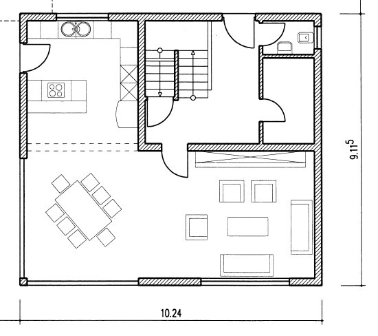 Grundriss: Küche links, Essbereich, Treppe in der Mitte, Wohnzimmer rechts, Bad oben rechts.