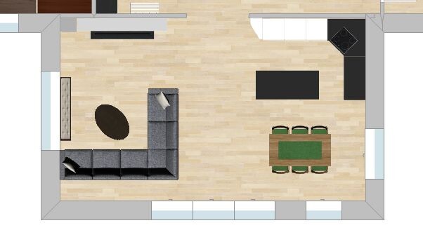 Offenes Wohnzimmer mit L-Sofa, rundem Teppich, Esstisch für 6 und offener Küche.