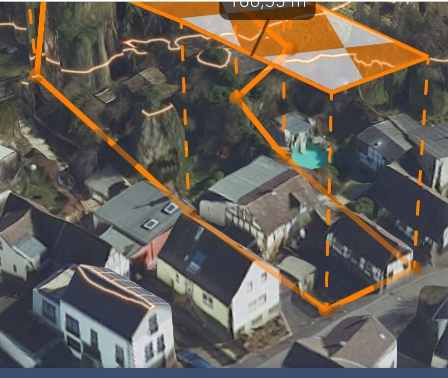 Luftaufnahme eines Wohnviertels mit orangefarbenen 3D-Boxen-Overlay und Geländemodell.