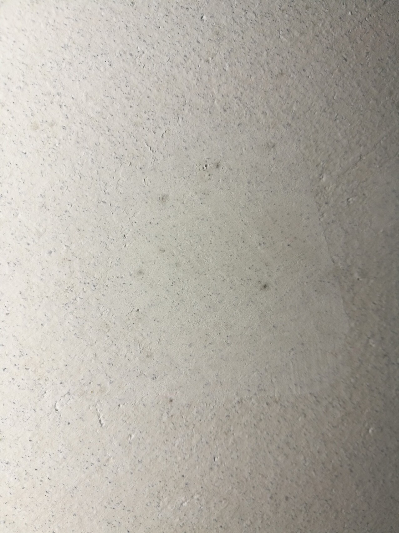 Rauhe Betonstruktur einer unbehandelten Oberfläche, Wand oder Boden.