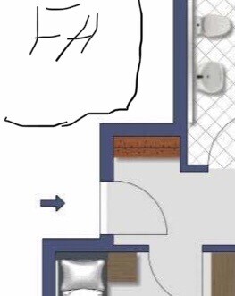 2D Grundriss eines Schlafzimmers mit Bett, Tür zum Flur und angrenzendem Badbereich