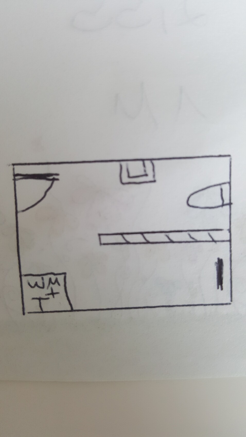 Handgezeichneter Grundriss eines Rechteckraums mit Tür links, Waschmaschine unten links.