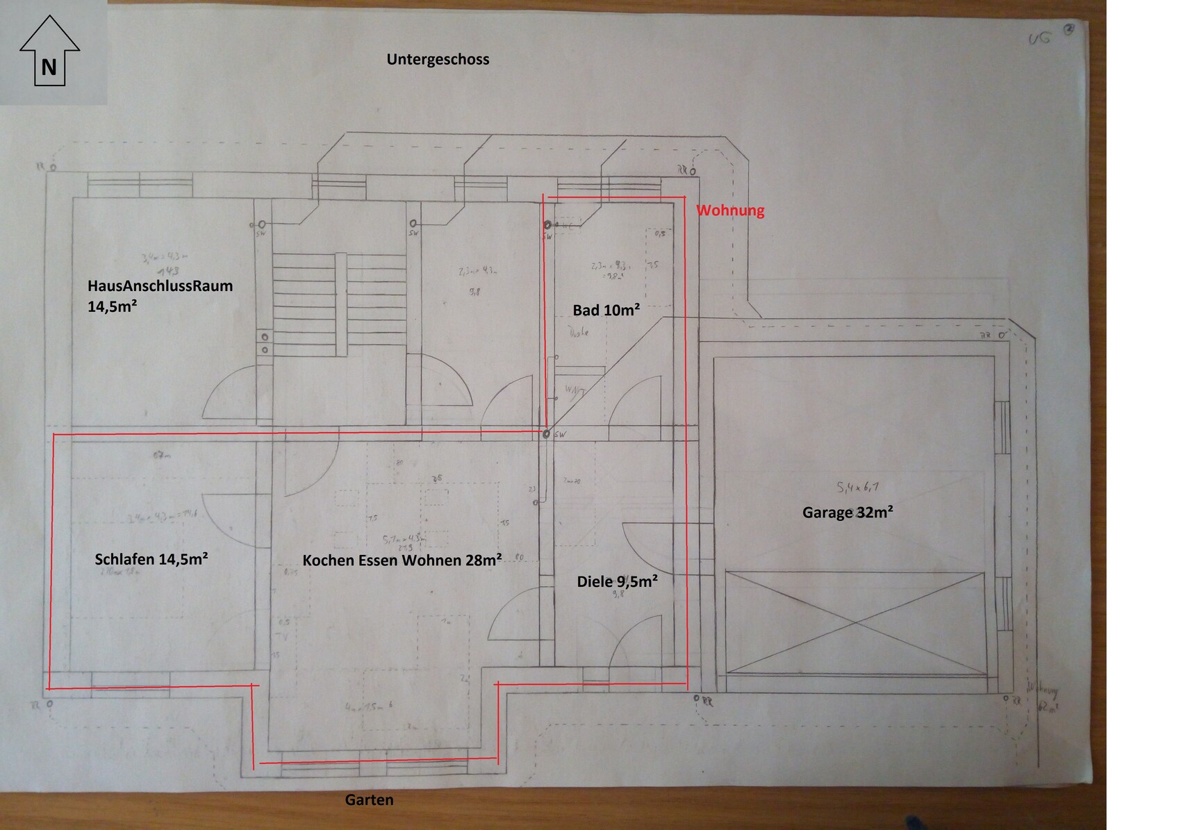 Untergeschoss Grundrissplan mit Schlafzimmer, Küche, Wohnen, Bad und Garage