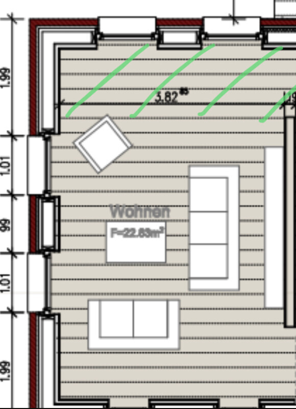 Grundriss eines Wohnzimmers mit Sofa, Sessel und Couchtisch, Fensterfront oben.